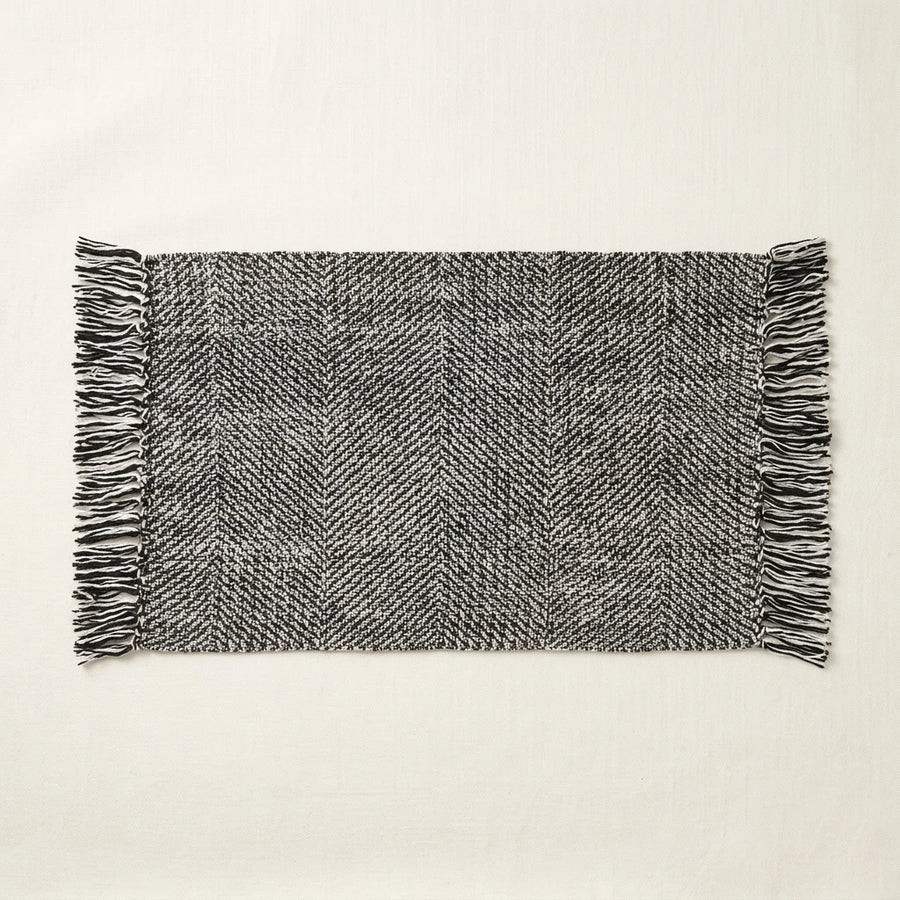 Boho Weave Rug Black White Solid Heathered Herringbone Fringe Woven Bath Mat Product Shot