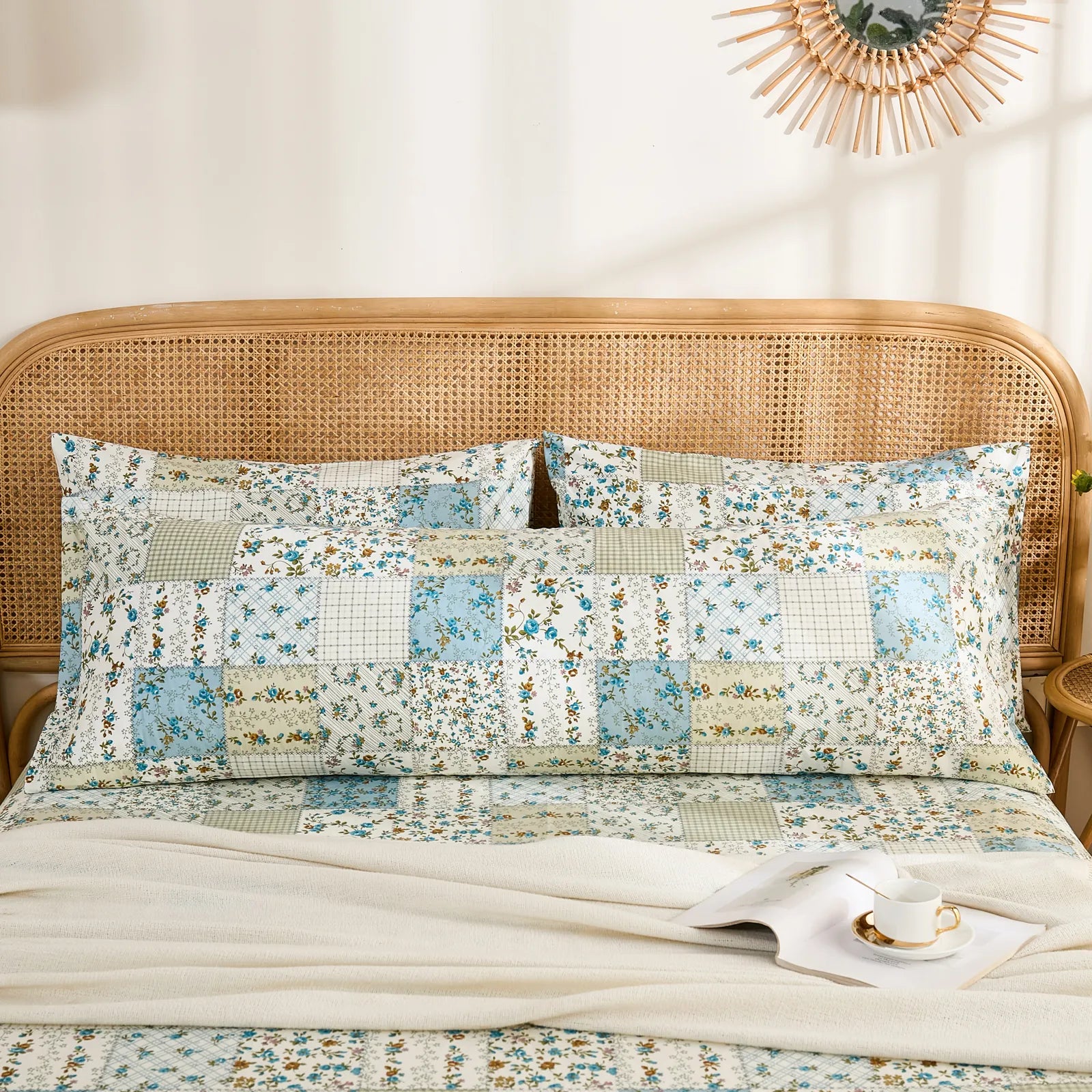 The long cotton body pillowcase placed horizontally behind two standard pillows for a layered bedding display.