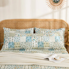 The long cotton body pillowcase placed horizontally behind two standard pillows for a layered bedding display.