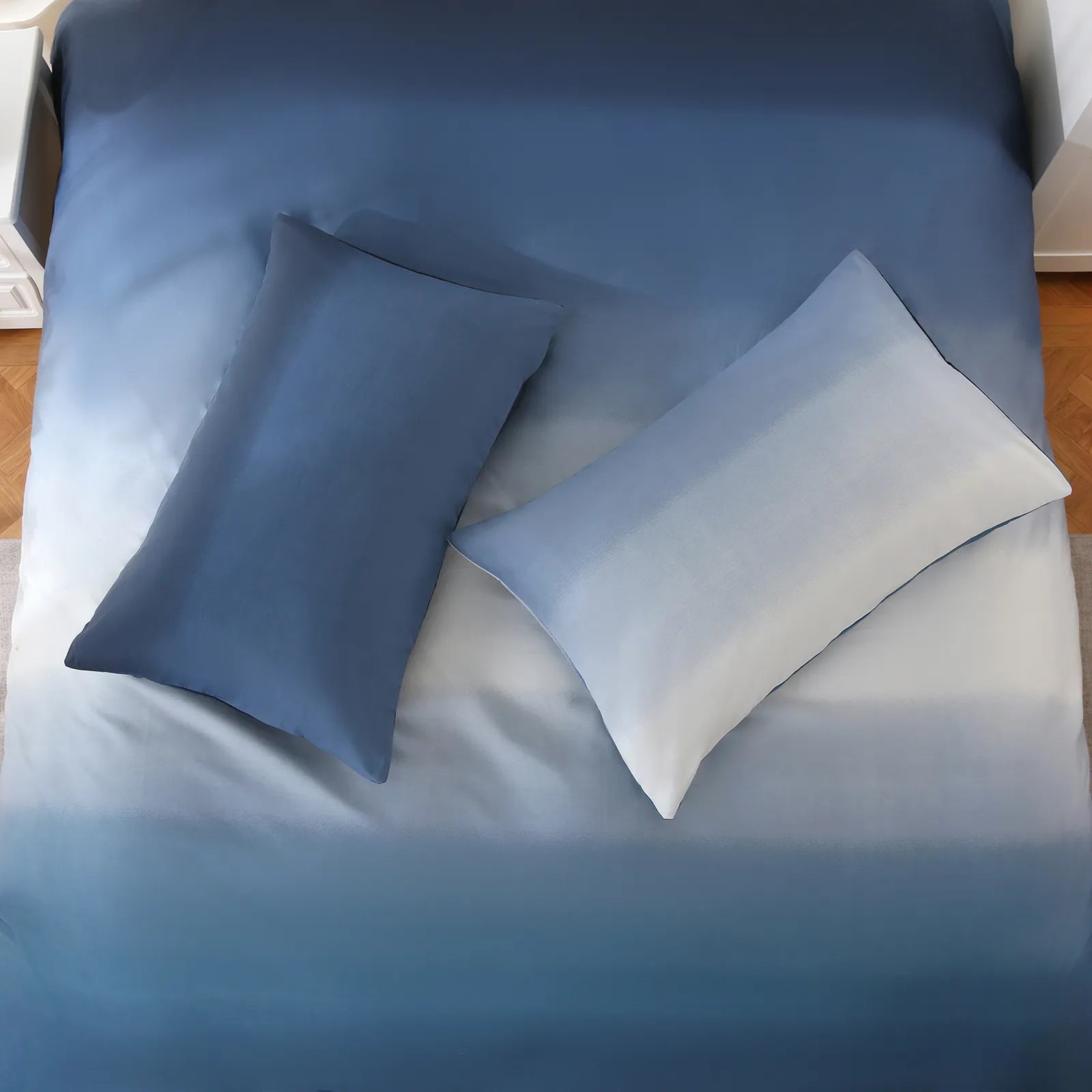 Bring the artistry of the ocean to your bedroom. This duvet cover features a beautiful watercolor-style gradient, with soft, blending strokes of navy, seafoam, and sky blue that mimic a hand-painted seascape.