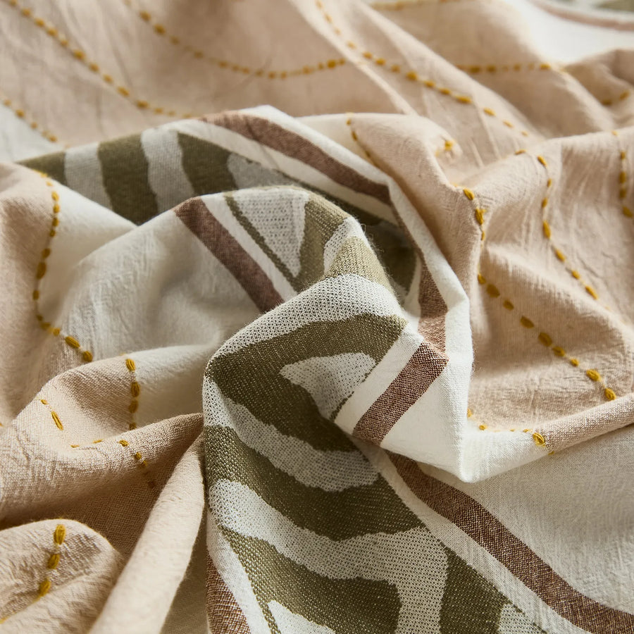 macro texture shot of 100 percent natural cotton fabric with detailed geometric and tribal prints