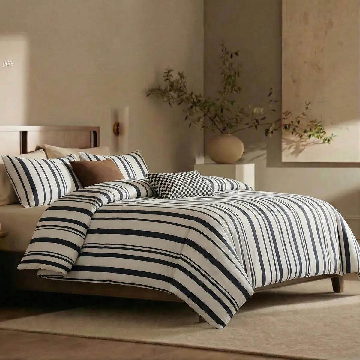 Angled shot of black and white striped duvet cover on bed