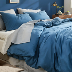 Blue duvet with folded corner revealing white sheet contrast