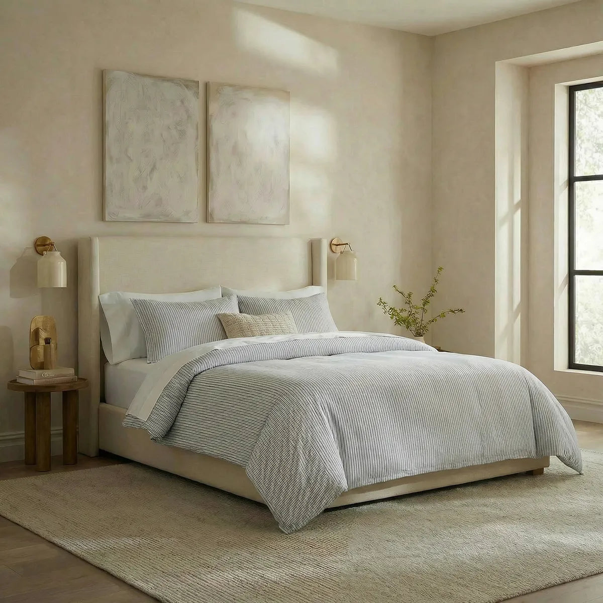 Angled shot of blue and white striped duvet cover on bed