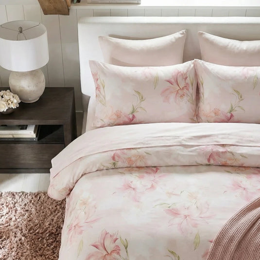 matching pink lily botanical print cotton pillow shams with soft cream bed linen