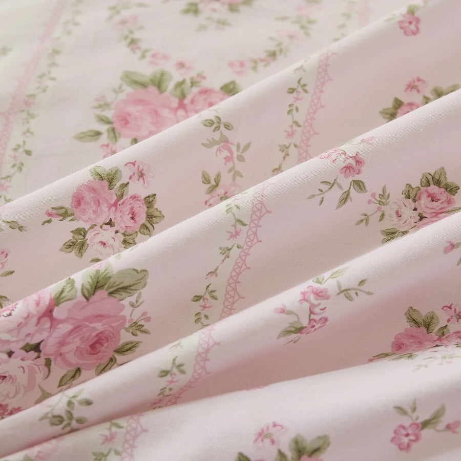close-up of pink rose floral cotton fabric texture showing detailed vertical striped print