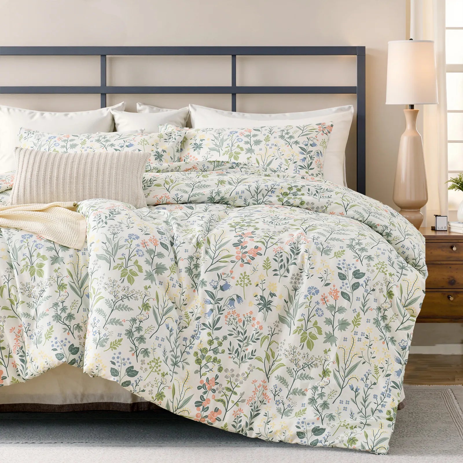 Vintage green floral cotton duvet cover on bed with geometric metal headboard and plant