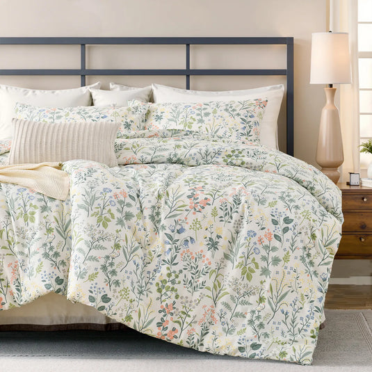 Vintage green floral cotton duvet cover on bed with geometric metal headboard and plant