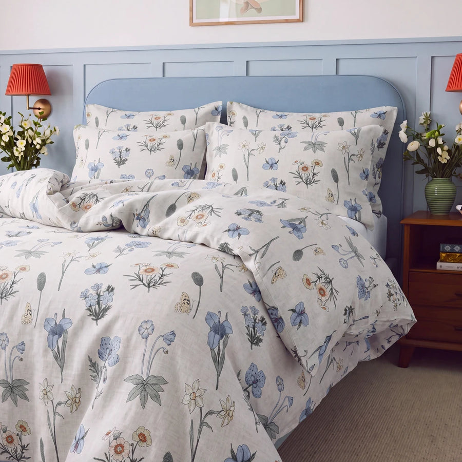 botanical whimsy floral duvet cover set blue headboard red wall sconces