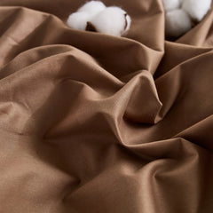 Brown duvet fabric detail showing natural folds with cotton placements