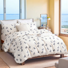 An inviting angled view of the butterfly duvet cover set on the bed