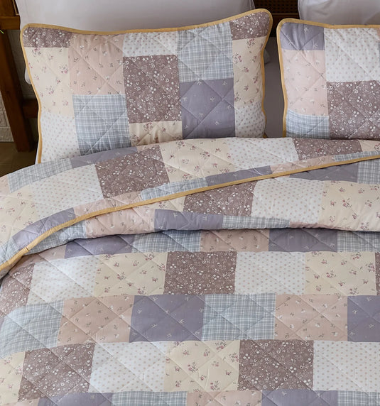 A detailed shot of the matching pillows and the quilted design