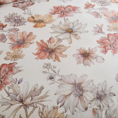 Close-up of the quilted texture and floral pattern on the comforter