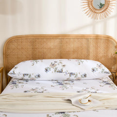 Curved Floral Print Cotton Body Pillowcase Against Wicker Headboard