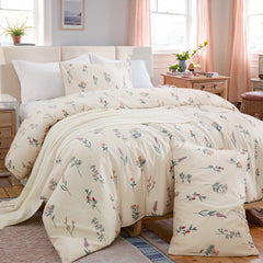 Full shot of the cute floral duvet cover set styled on a bed in a cozy room