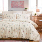 Full view of the cute floral pillowcases styled on a bed with a comforter