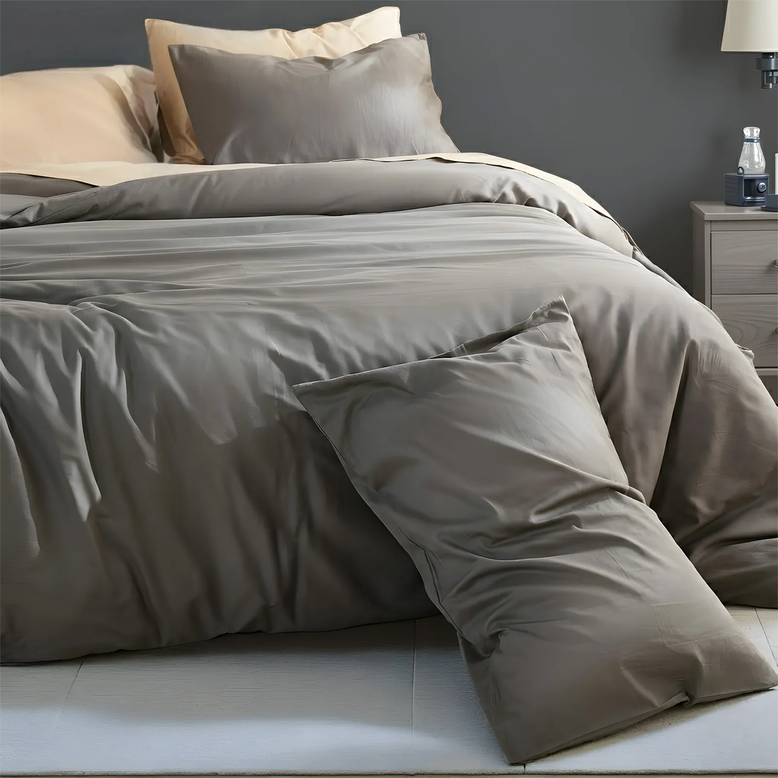 Corner perspective of dark gray duvet with single pillow placement