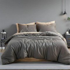 Dark gray solid duvet front view with two pillows on bed