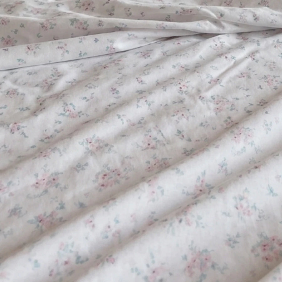 dreamy pastel sheet set ditsy floral fabric closeup