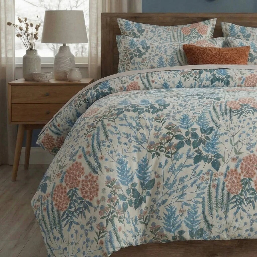 blue botanical leaf print cotton bedding set with a shabby chic farmhouse aesthetic