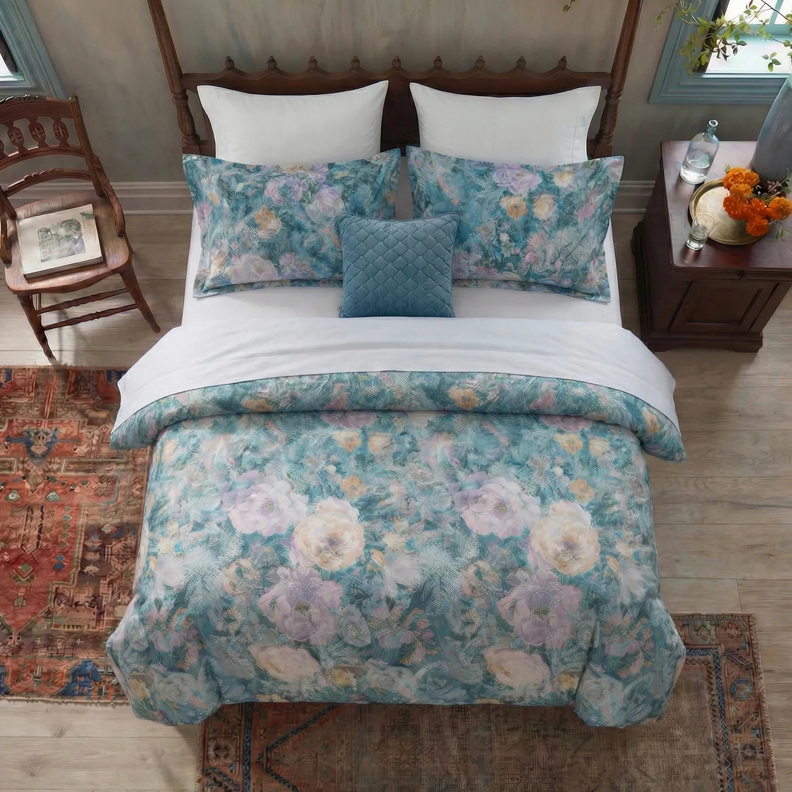 Top down view of blue floral duvet and matching shams