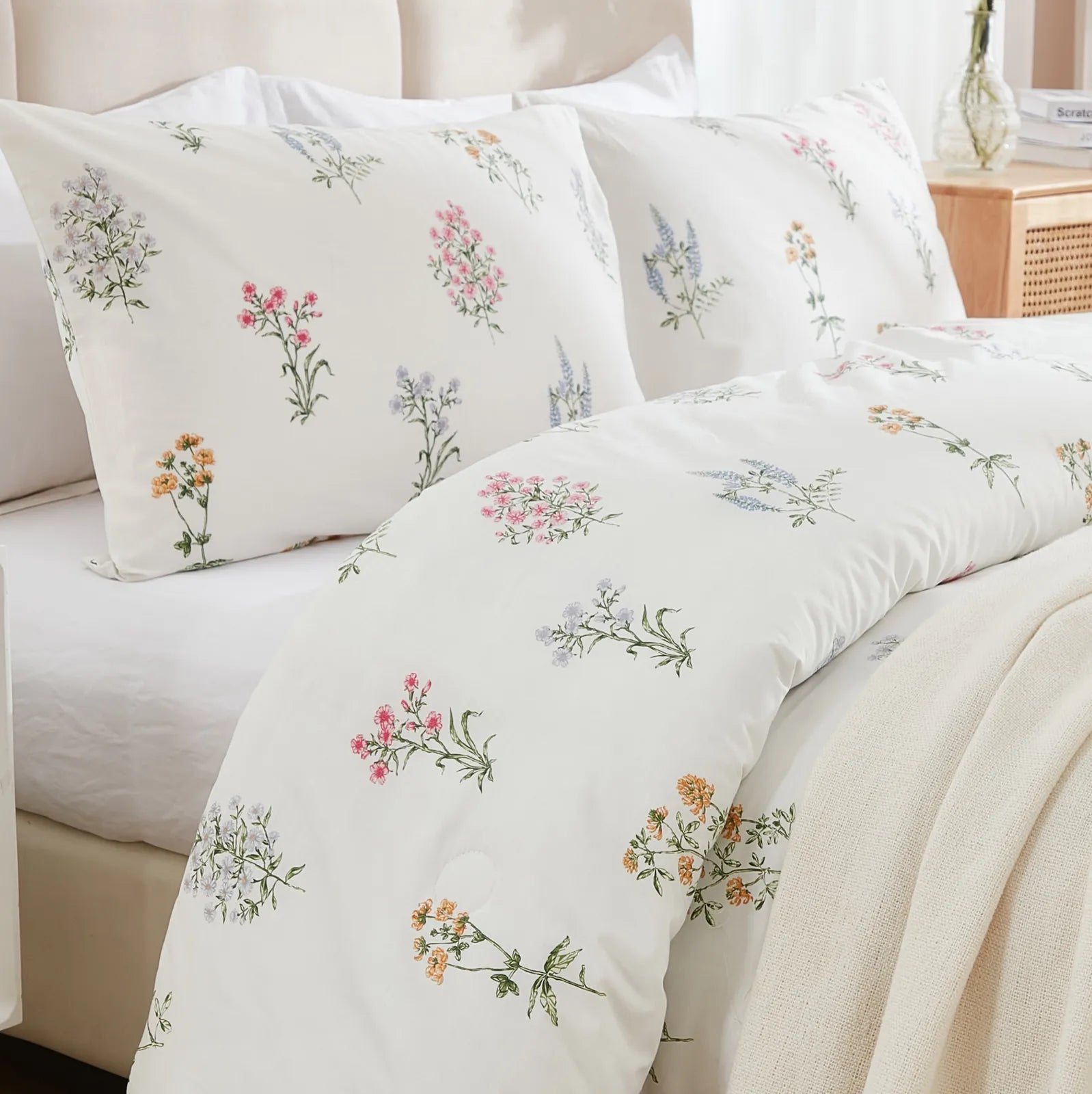 A detailed view of the duvet cover set from a bed corner angle