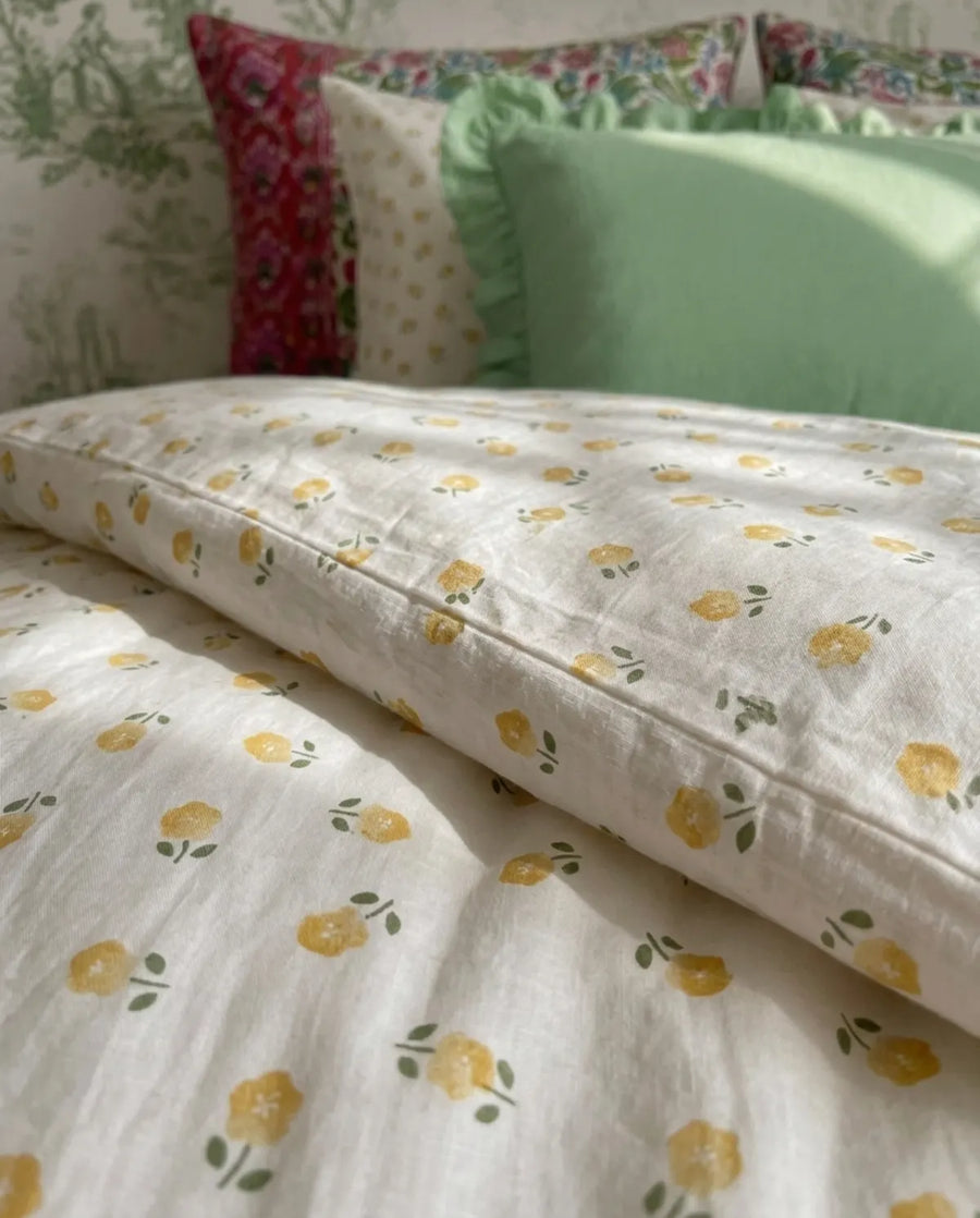 golden ditsy floral duvet cover close up folded edge texture