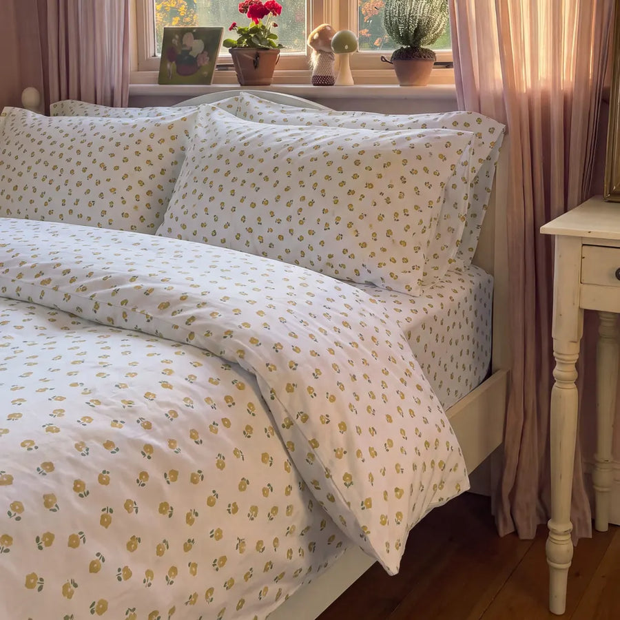 golden ditsy floral duvet cover set nightstand vintage mirror decor