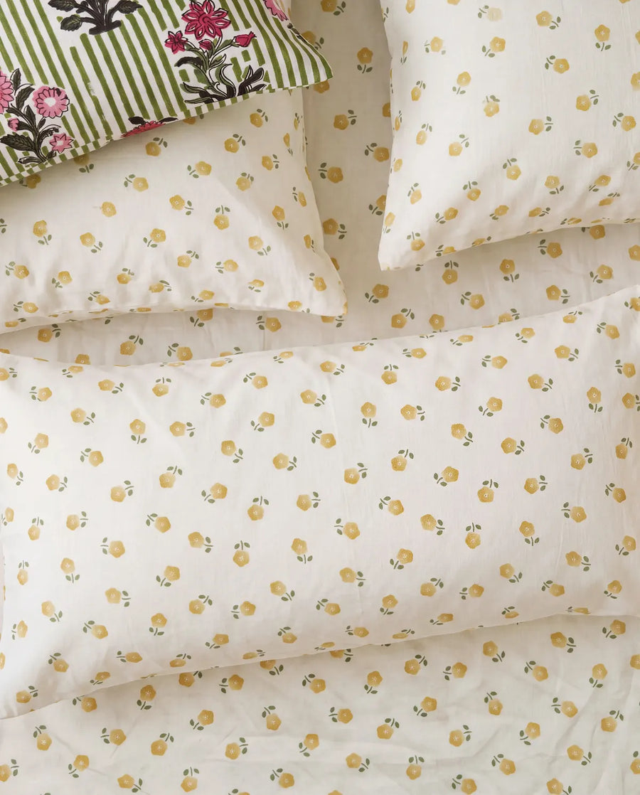golden ditsy floral pillowcases yellow flower print closeup