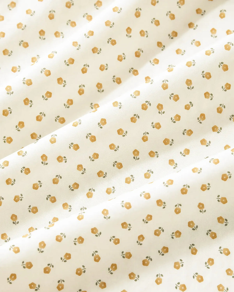 golden ditsy floral shower curtain fabric closeup