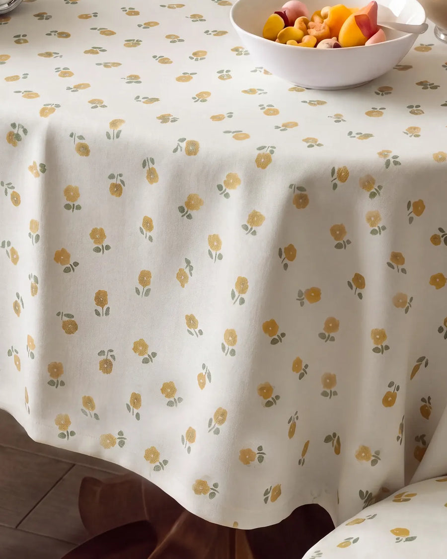 golden ditsy floral tablecloth fabric closeup