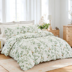 An angled view of the green leaf comforter set with pillows.