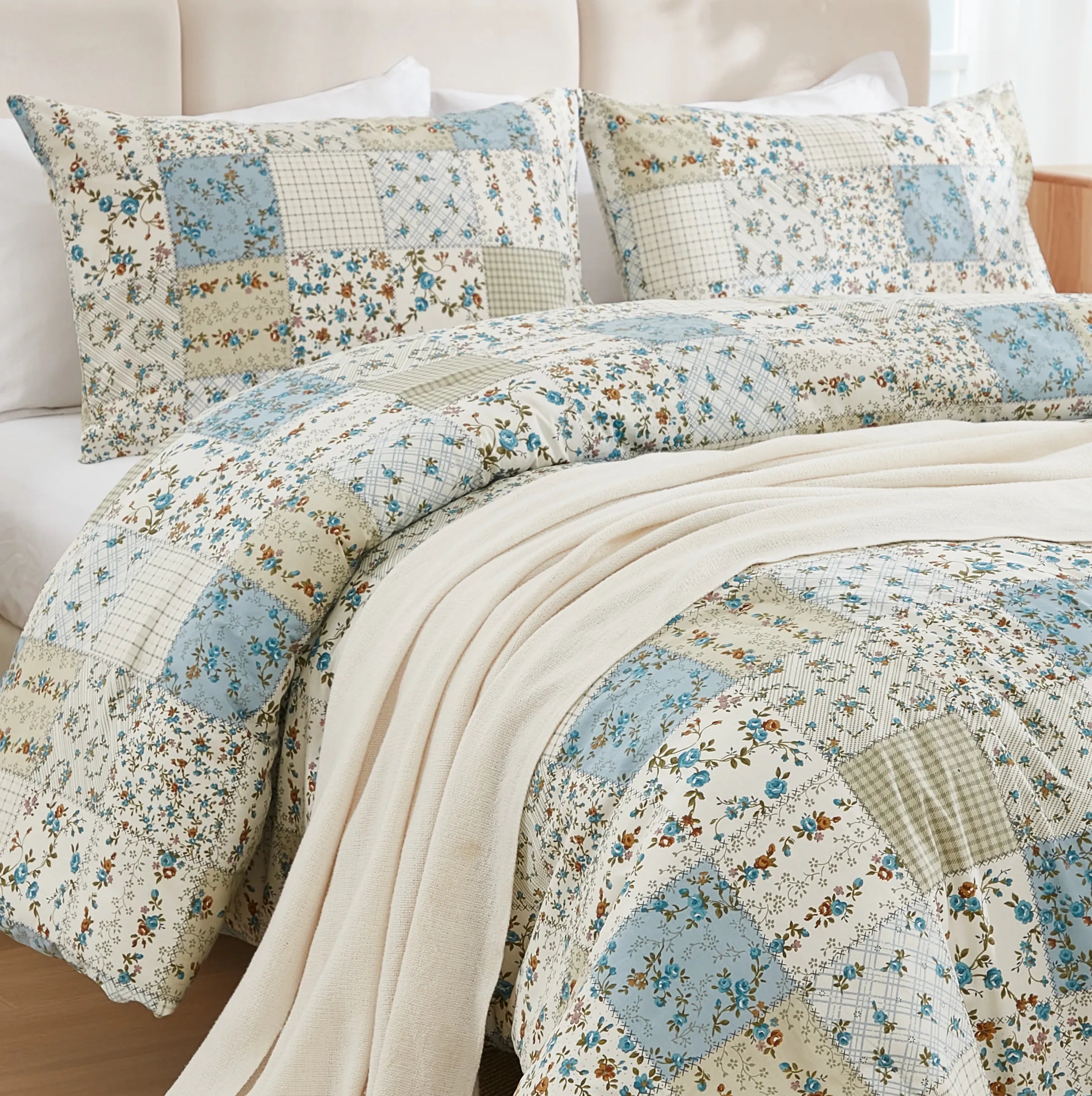 A close-up shot of the green patchwork pattern on the comforter set