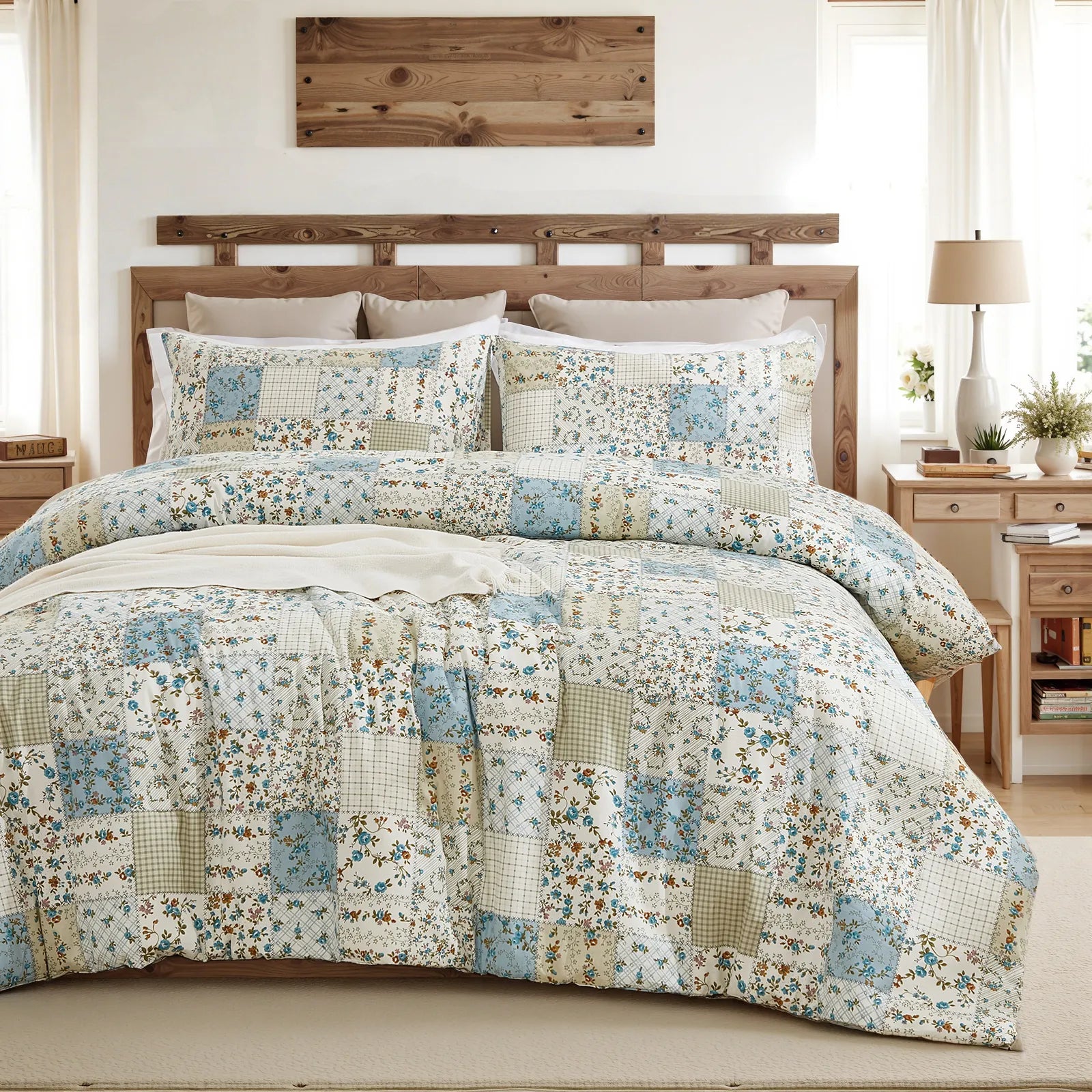 The green patchwork comforter set styled on a bed in a bright, modern bedroom