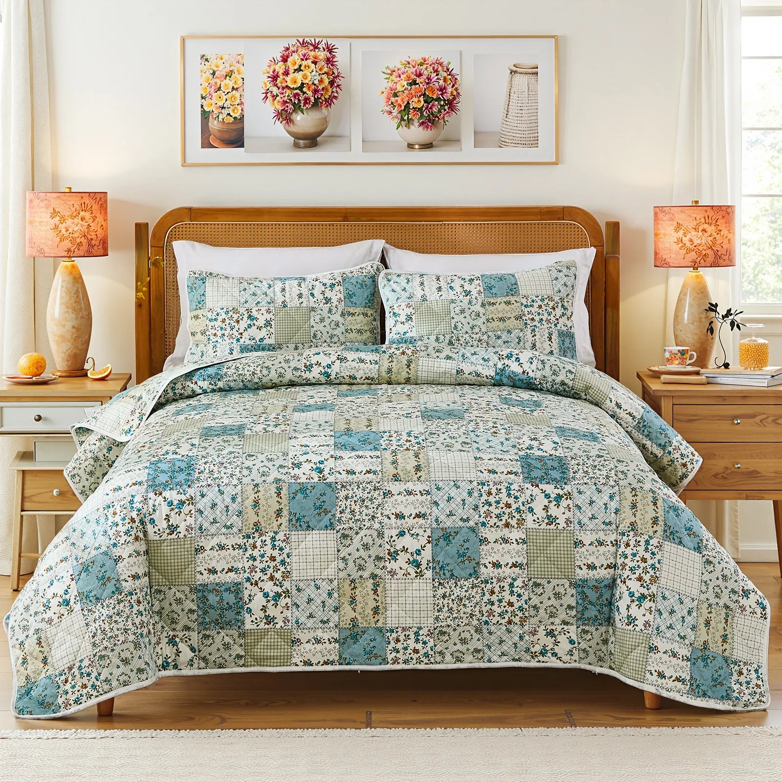 A complete bedroom scene featuring a bed with a green and blue patchwork quilt set, two lamps, and wall art.