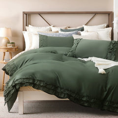 Angled view of the green ruffled comforter set showing the full bed and pillows