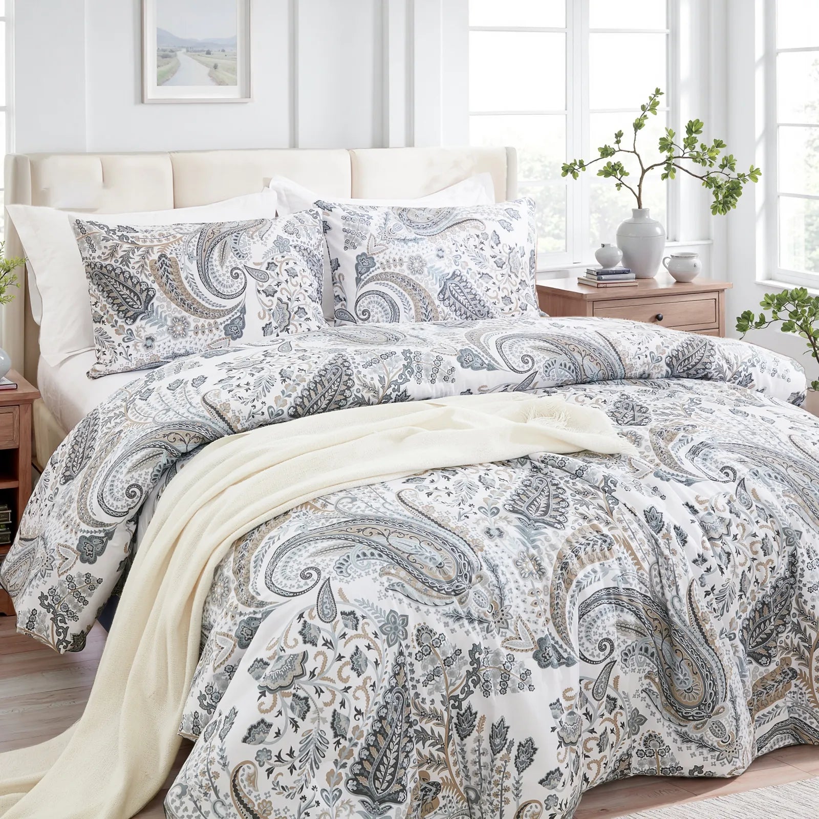 Full view of the grey paisley duvet cover set styled on a bed