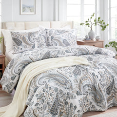 Full view of the grey paisley duvet cover set styled on a bed