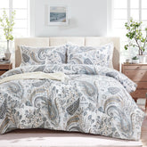 The grey paisley duvet cover set styled in a cozy, modern bedroom