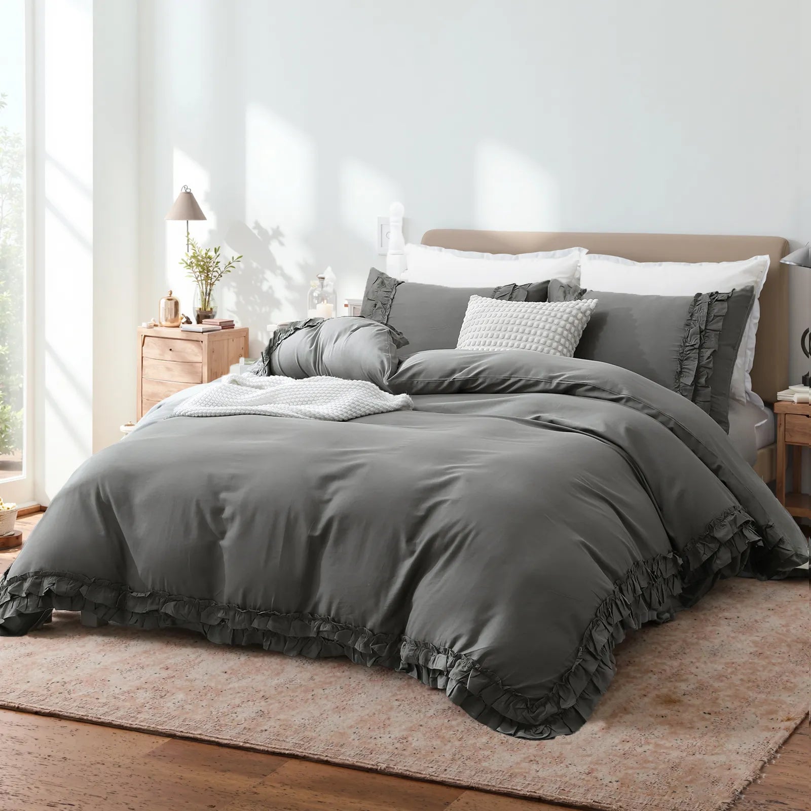 Side view of the grey ruffled comforter set, highlighting the texture and drape
