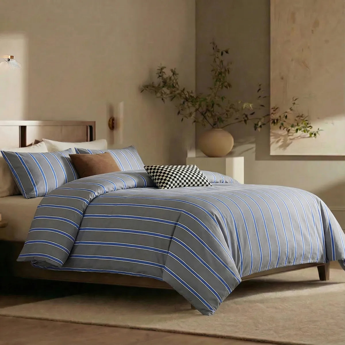 Angled shot of grey blue striped duvet cover on bed