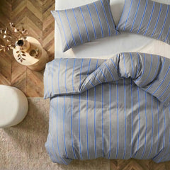Overhead flat lay of grey blue striped duvet and cases