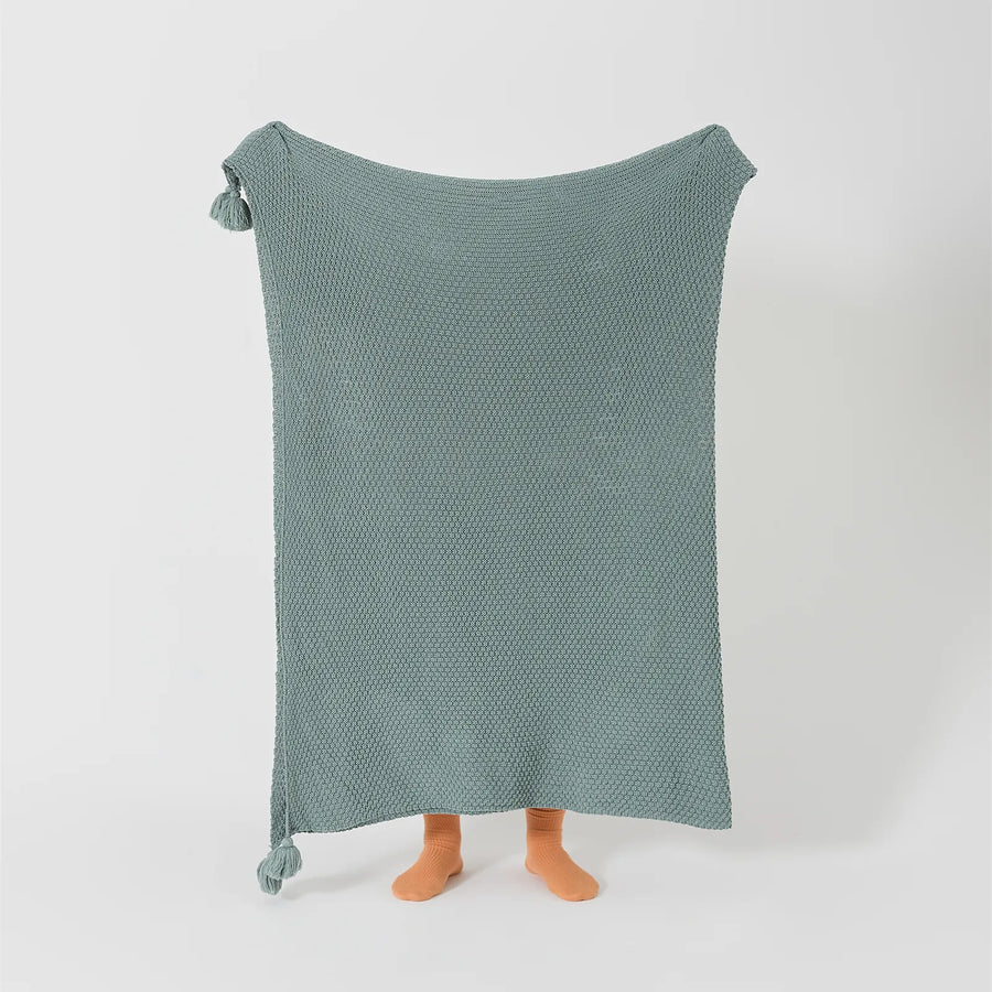 Person Holding Up Aqua Knitted Throw Blanket Full Length Display