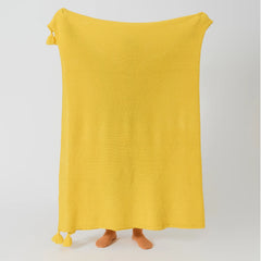 Person Holding Up Sunny Yellow Knitted Throw Blanket Full Length