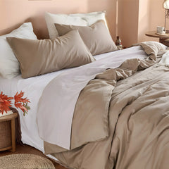 Close-up of light brown duvet at headboard area