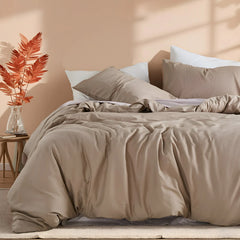 Side view of light brown duvet with pillow arrangement