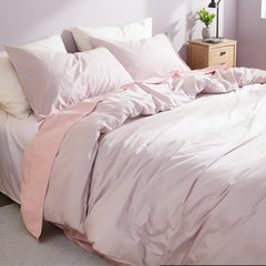 Oblique top-down view of light purple duvet with natural folds.