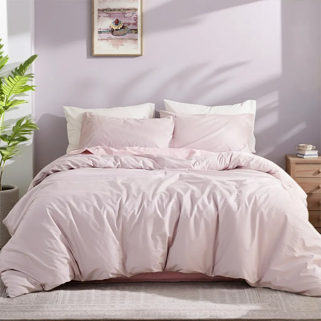 Full front view of light purple solid cotton duvet on bed with pillows, showing complete bedding layout and soft shadow effects.