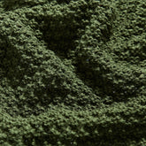Macro Close-up of Dark Green Knitted Fabric Texture and Detail