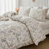 Close-up of the delicate meadow floral pattern and texture on the comforter